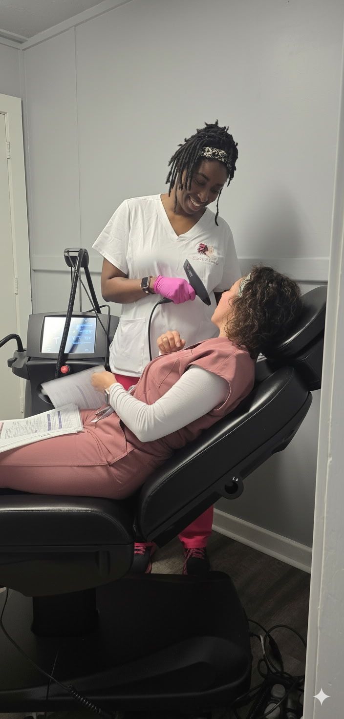 Dental hygienist cleaning a patient’s teeth in a black chair, with a pink bib in a clinic setting