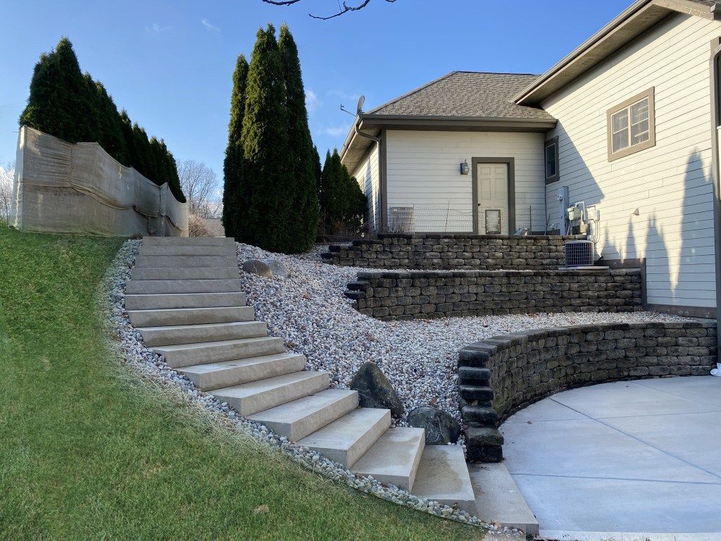 A white house with stairs leading up to it