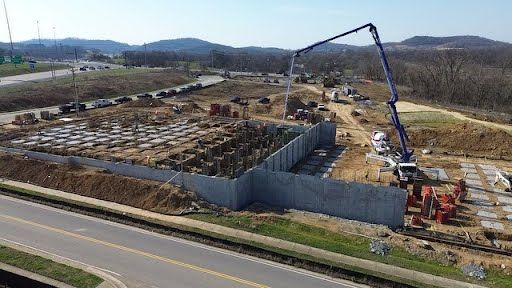 An aerial view of a construction site next to a road.