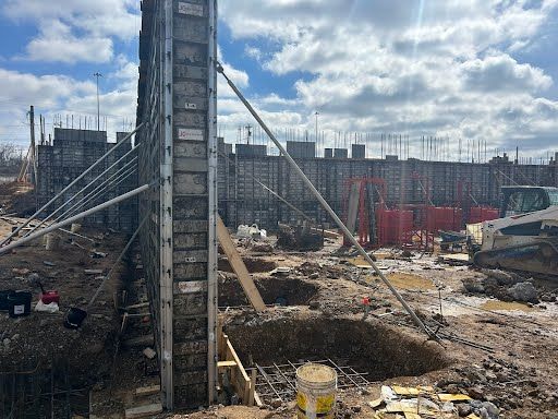 A large building is being built on a construction site.