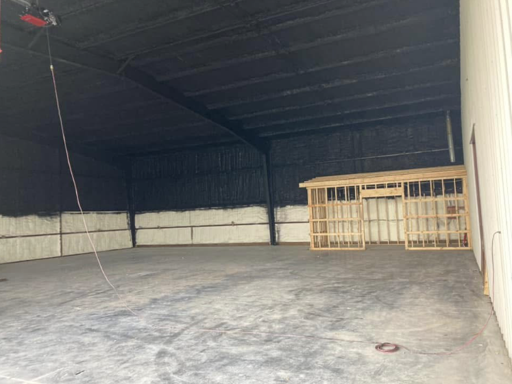 A large warehouse with a lot of insulation on the walls and ceiling.