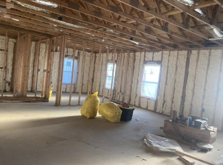 A room in a house under construction with a lot of insulation.