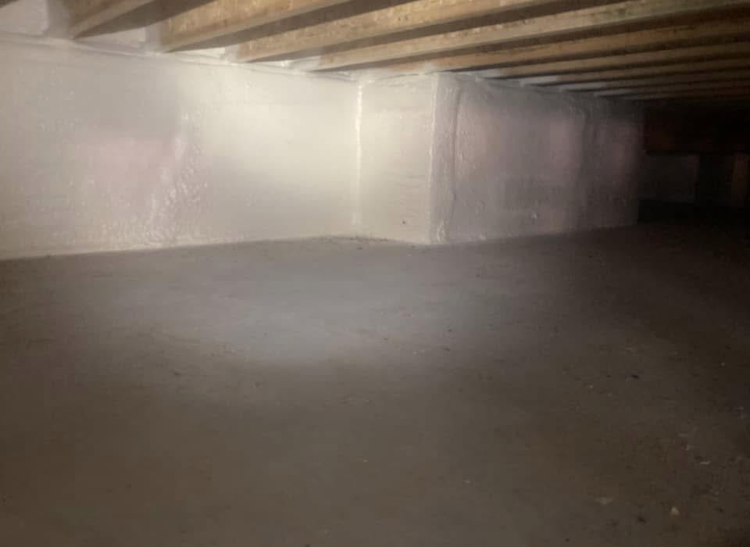 A very dark room with a lot of wooden beams on the ceiling.