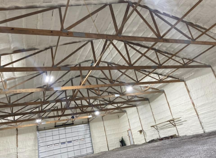 A large warehouse with a roof that is covered in foam.