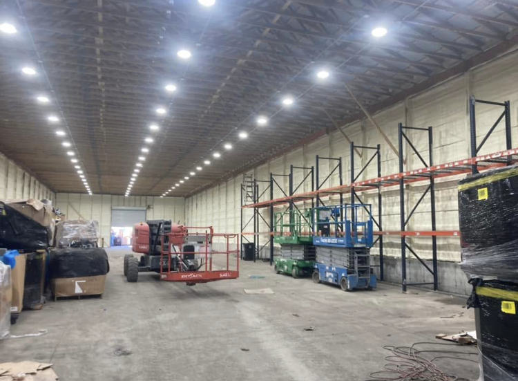 A large warehouse with a lot of machinery in it