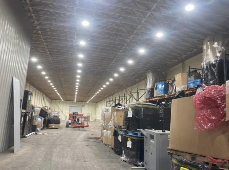 A large warehouse filled with lots of boxes and equipment.
