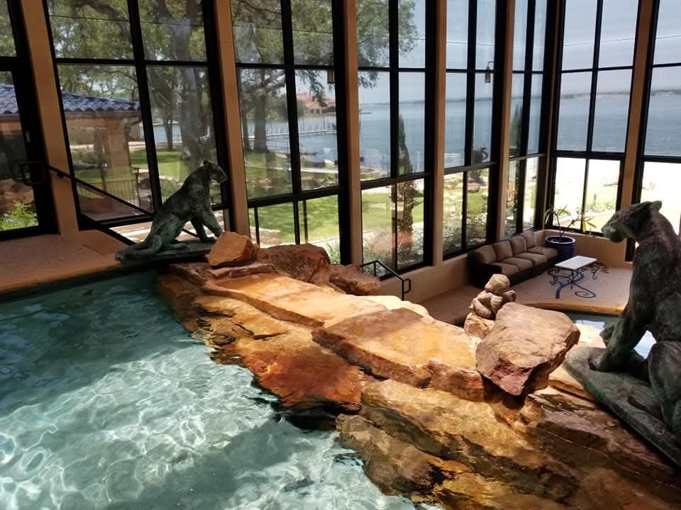 A swimming pool with a statue of a bear in it