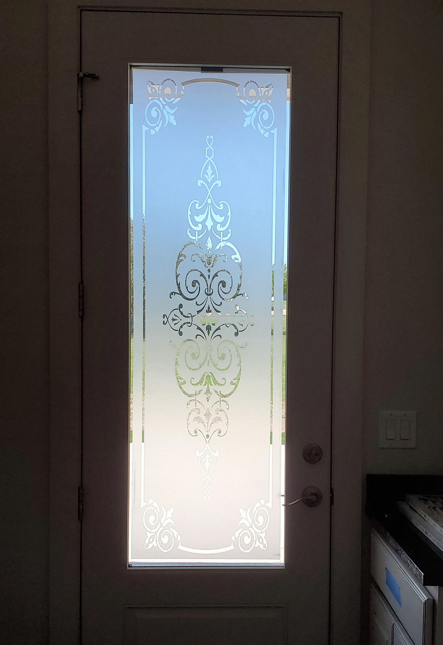 A white door with a floral design on it