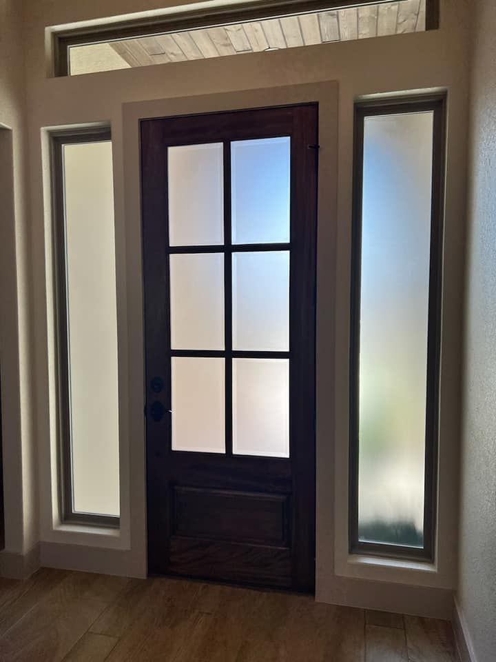 A door with a lot of windows around it