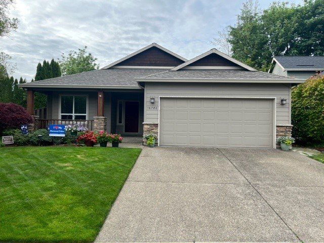 house parking walkway with garden