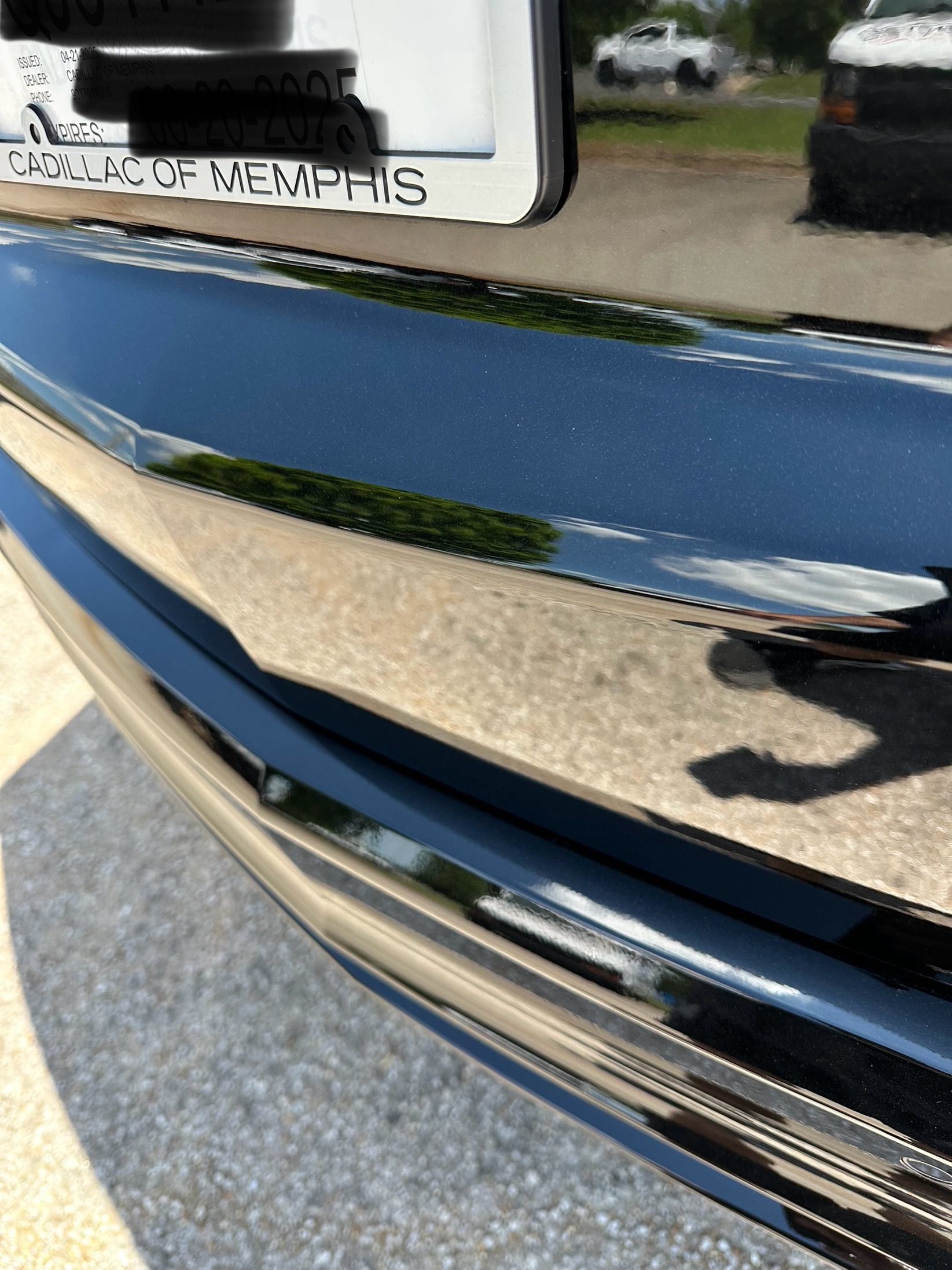 A close up of a blue car with a license plate that says memphis