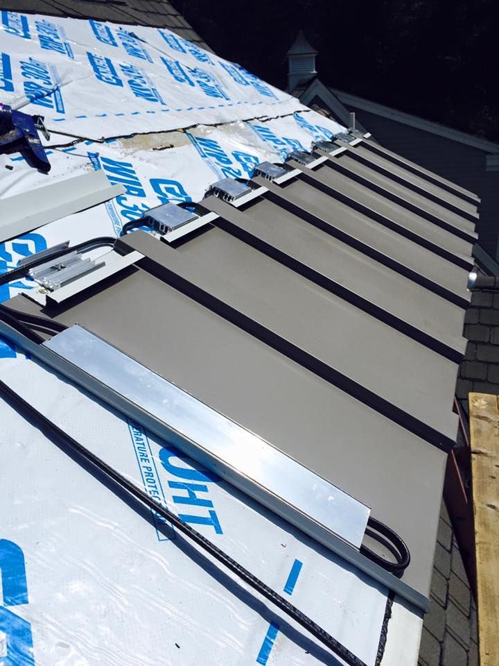 A roof with a lot of chimneys on it