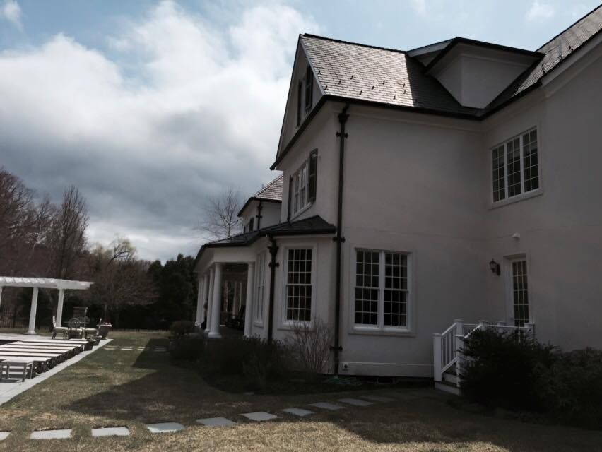 A large white house with a slate roof