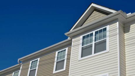 A house with a blue sky in the background