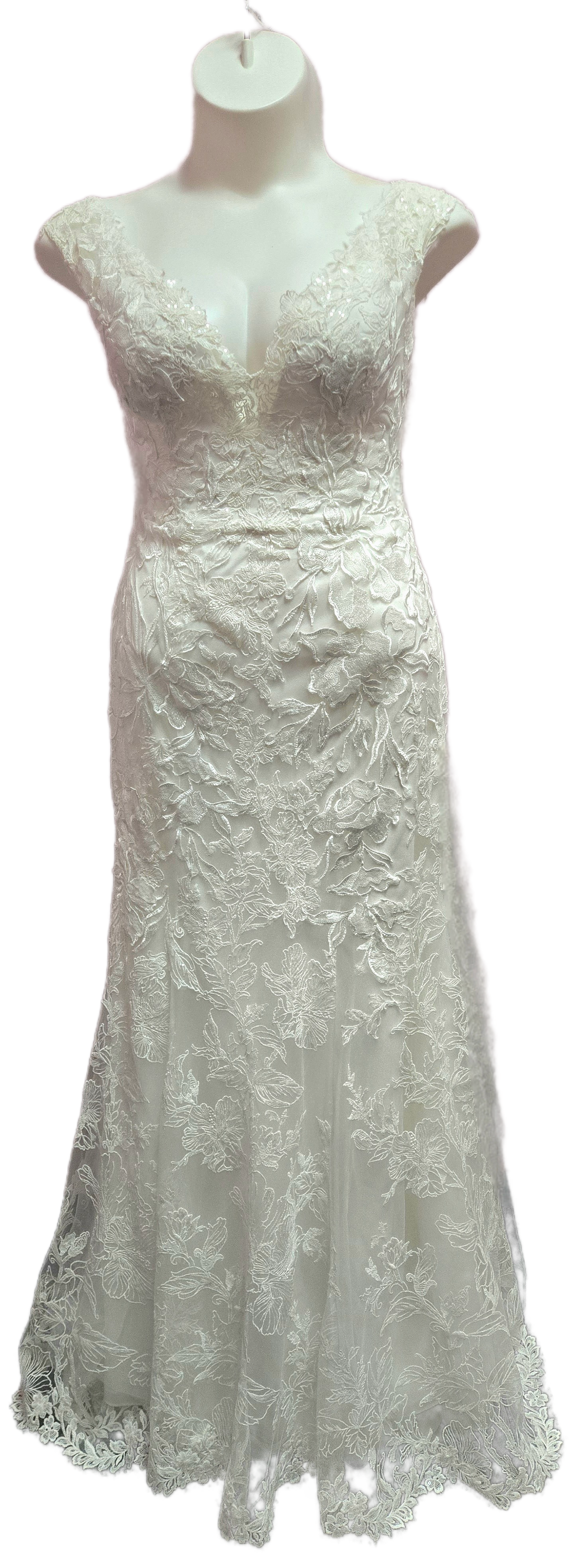 White wedding dress on a mannequin; fitted bodice and flared skirt with detailed lace pattern.
