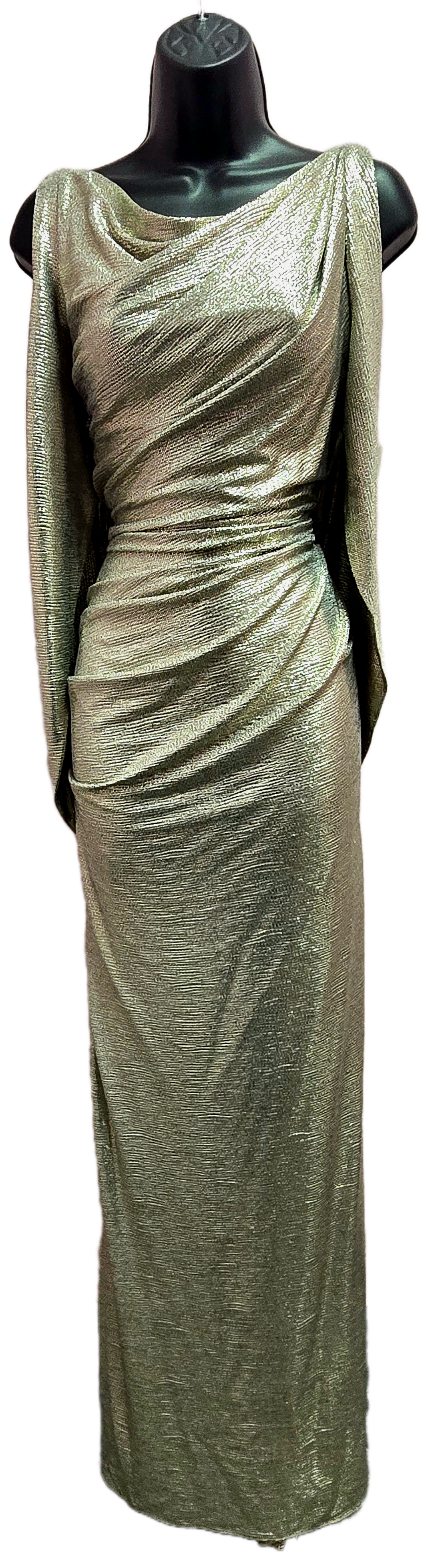 A floor-length, shimmering gold gown on a mannequin. It has long sleeves and a draped cowl neckline.