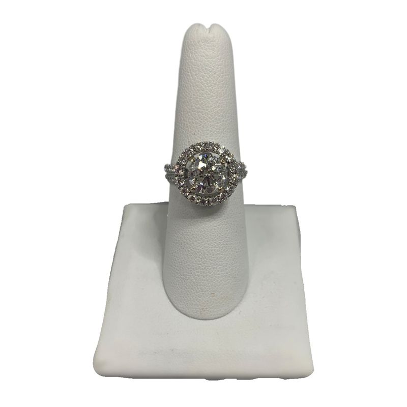 A ring is sitting on a white ring holder