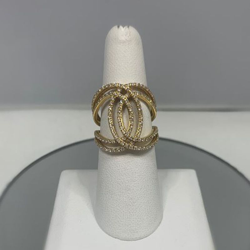 A gold ring with a chanel logo on it