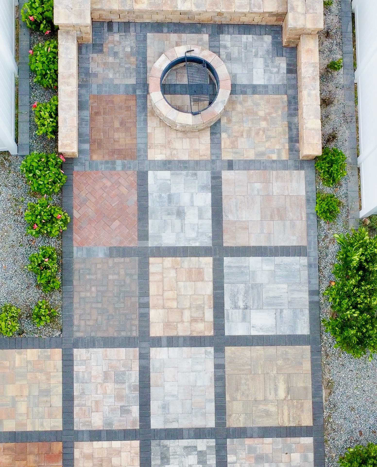 an aerial view of a patio with a firepit