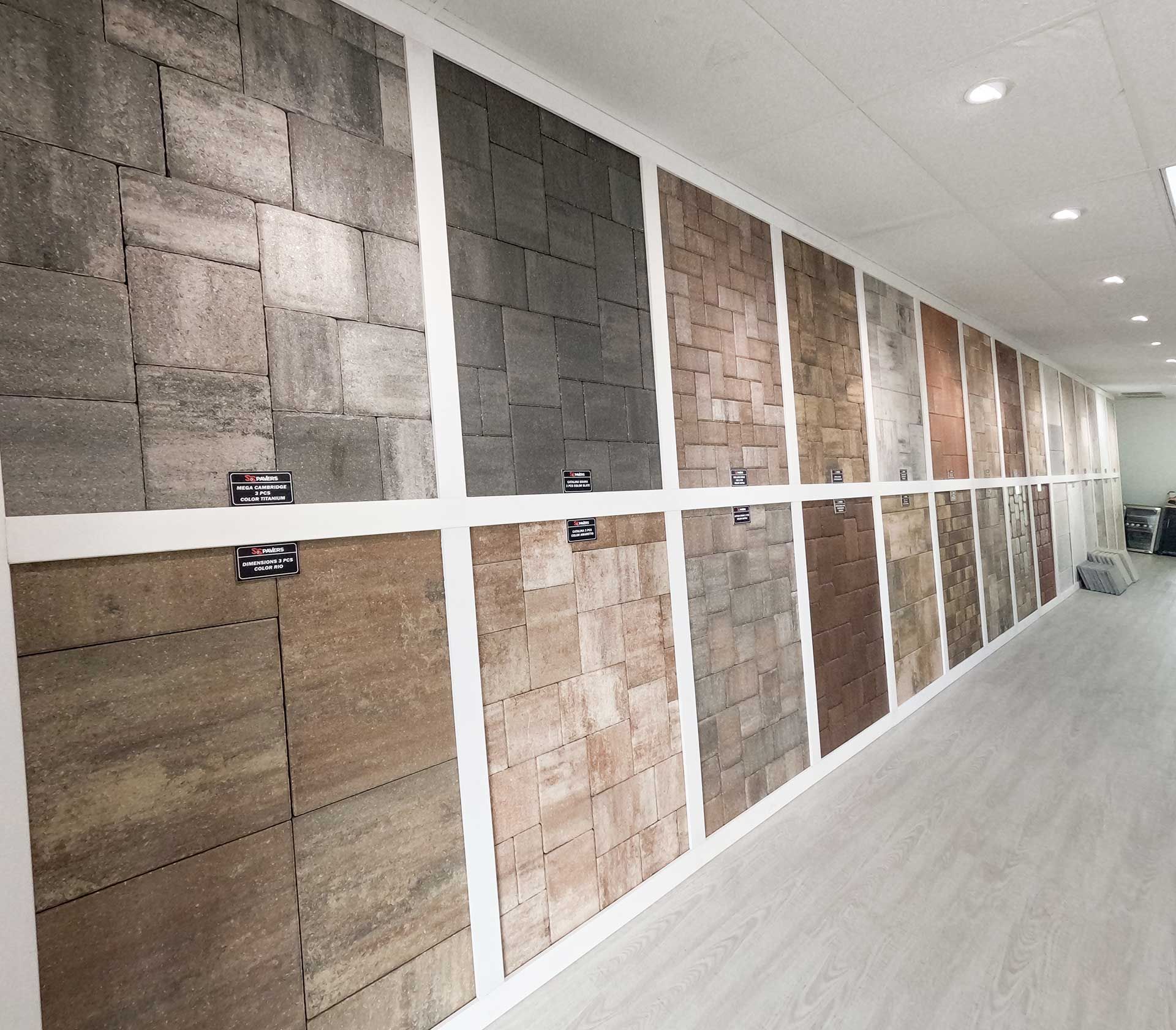 a long hallway filled with pavers of different colors