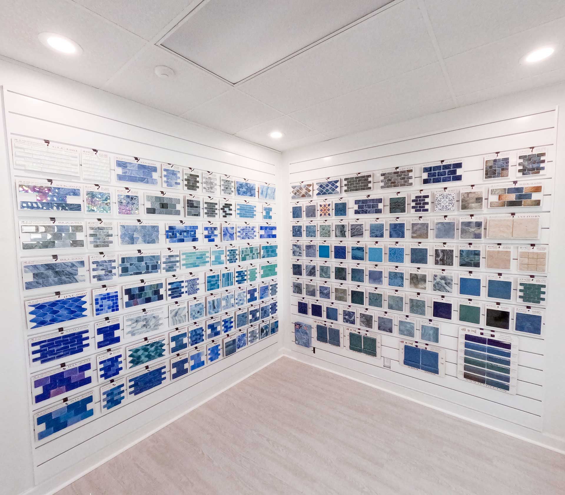 a room with a lot of blue tiles on the wall