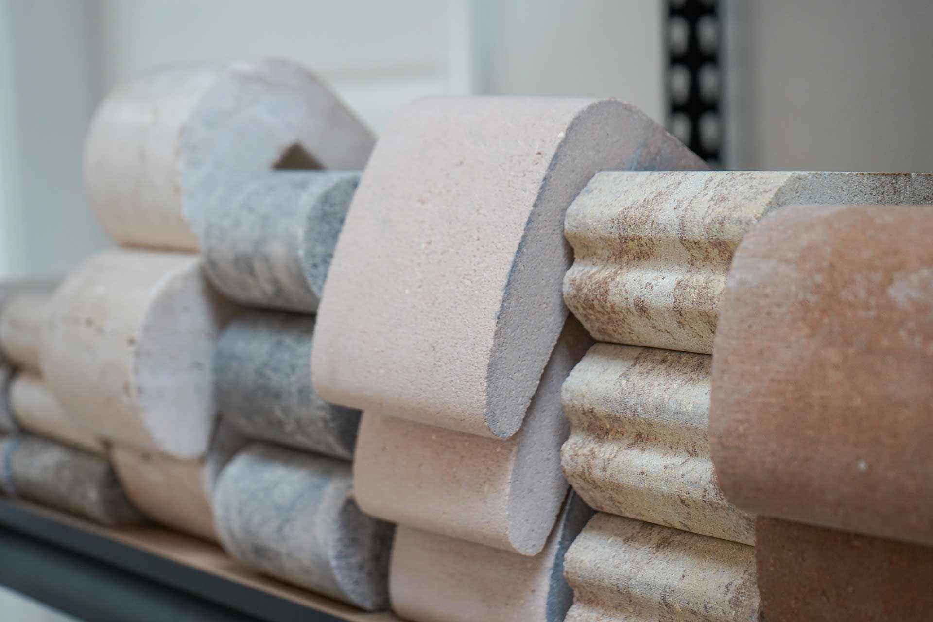 a row of marble pieces stacked on top of each other on a shelf