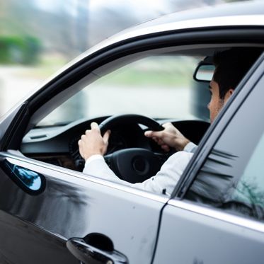Man driving a car
