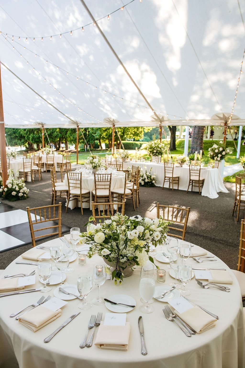 Elegant outdoor wedding reception under a white