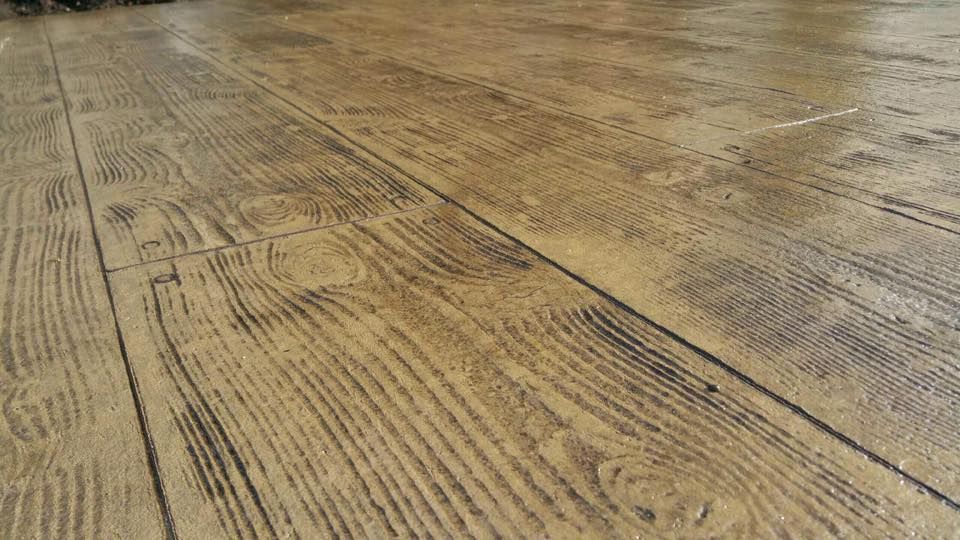 A close up of a concrete floor that looks like wood.