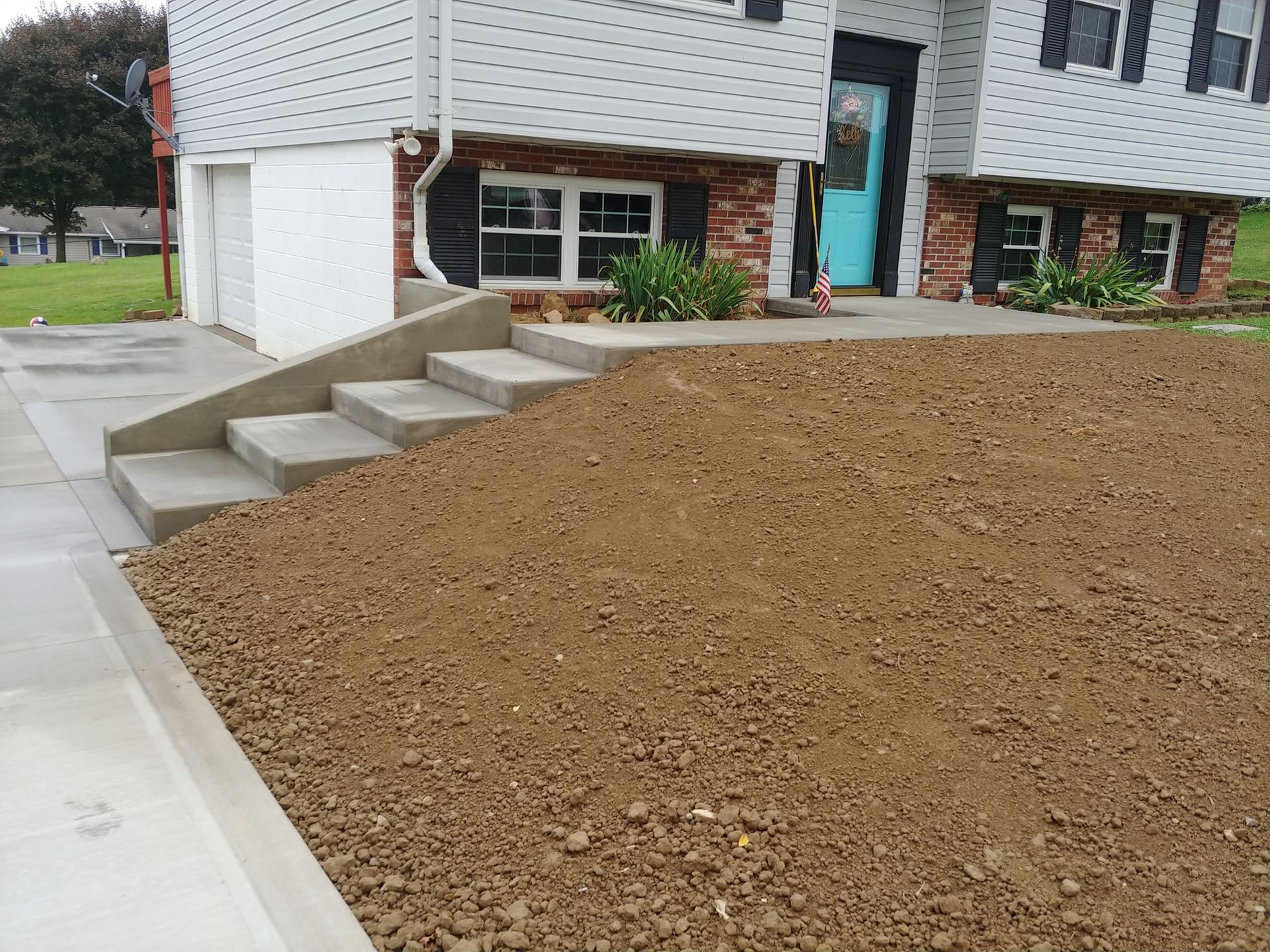 A house with stairs leading up to the front door