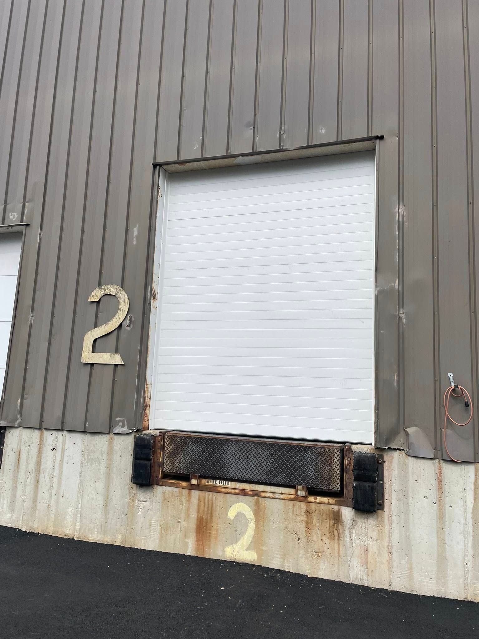 Warehouse loading dock door labeled 