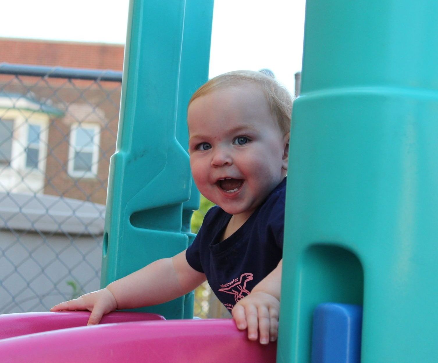 Infant playing plastic balls