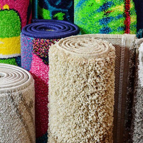 Many colorful carpets in the store