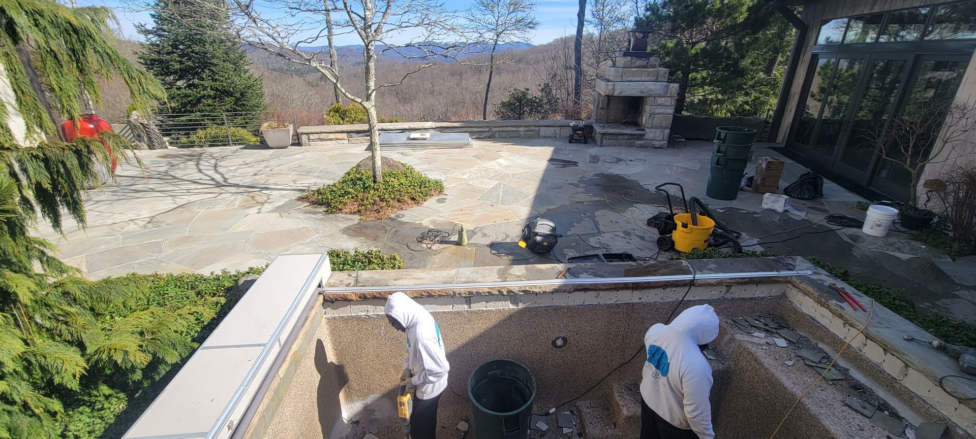 A group of people are working on a swimming pool.