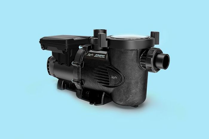 A black swimming pool pump is sitting on a blue surface.