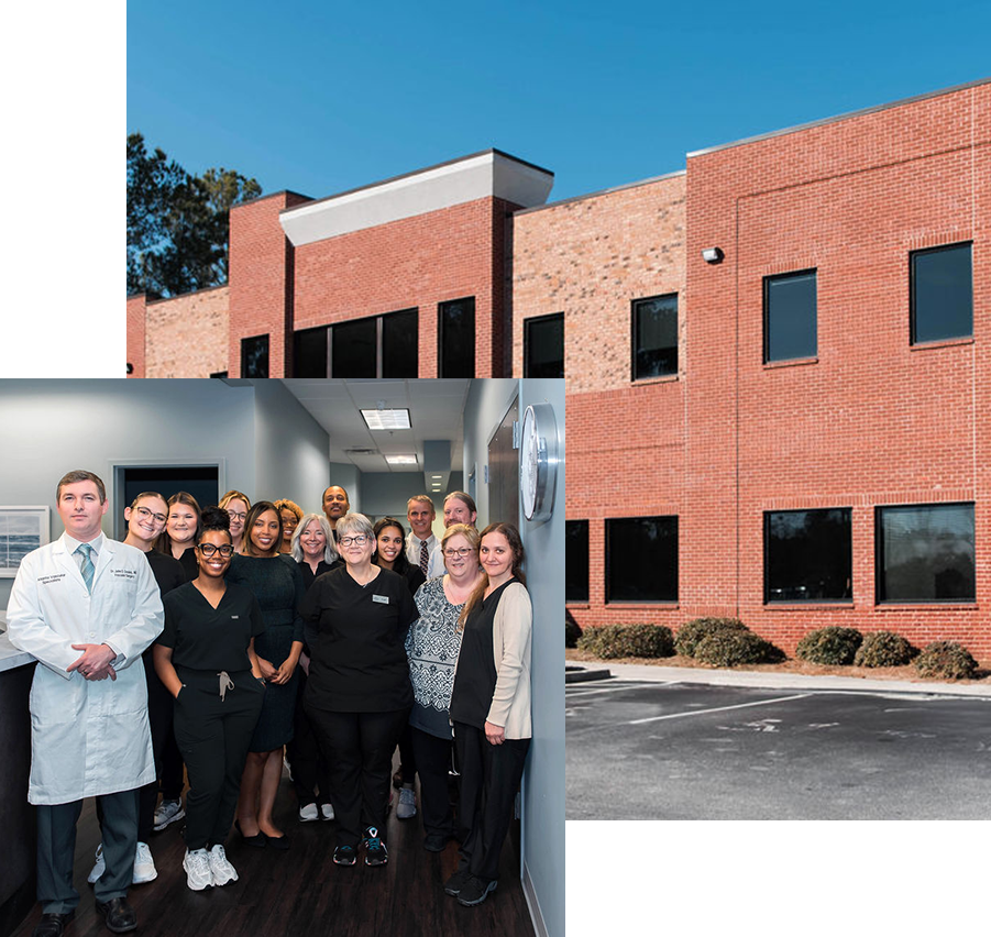 A group of people standing in front of a brick building