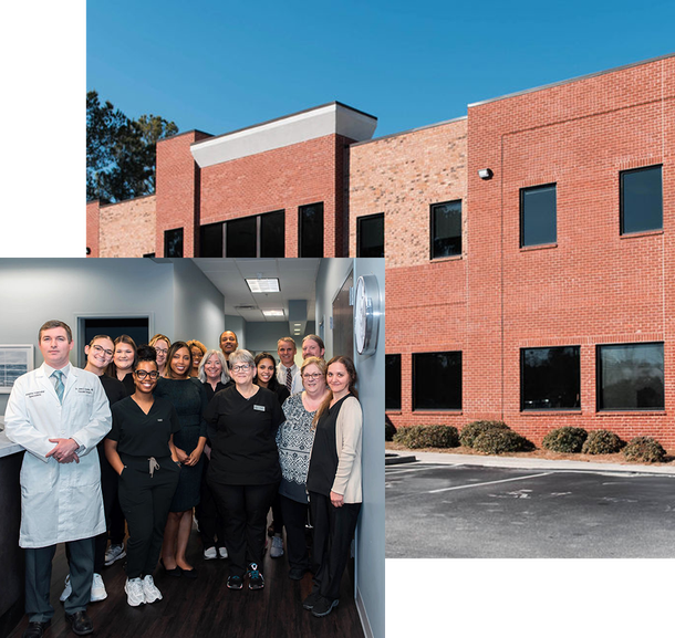 A group of people standing in front of a brick building