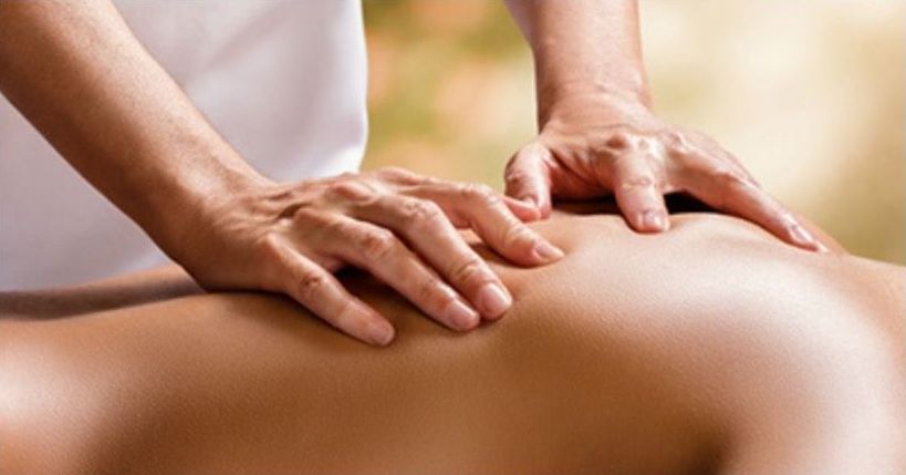 A person is getting a massage from a massage therapist.