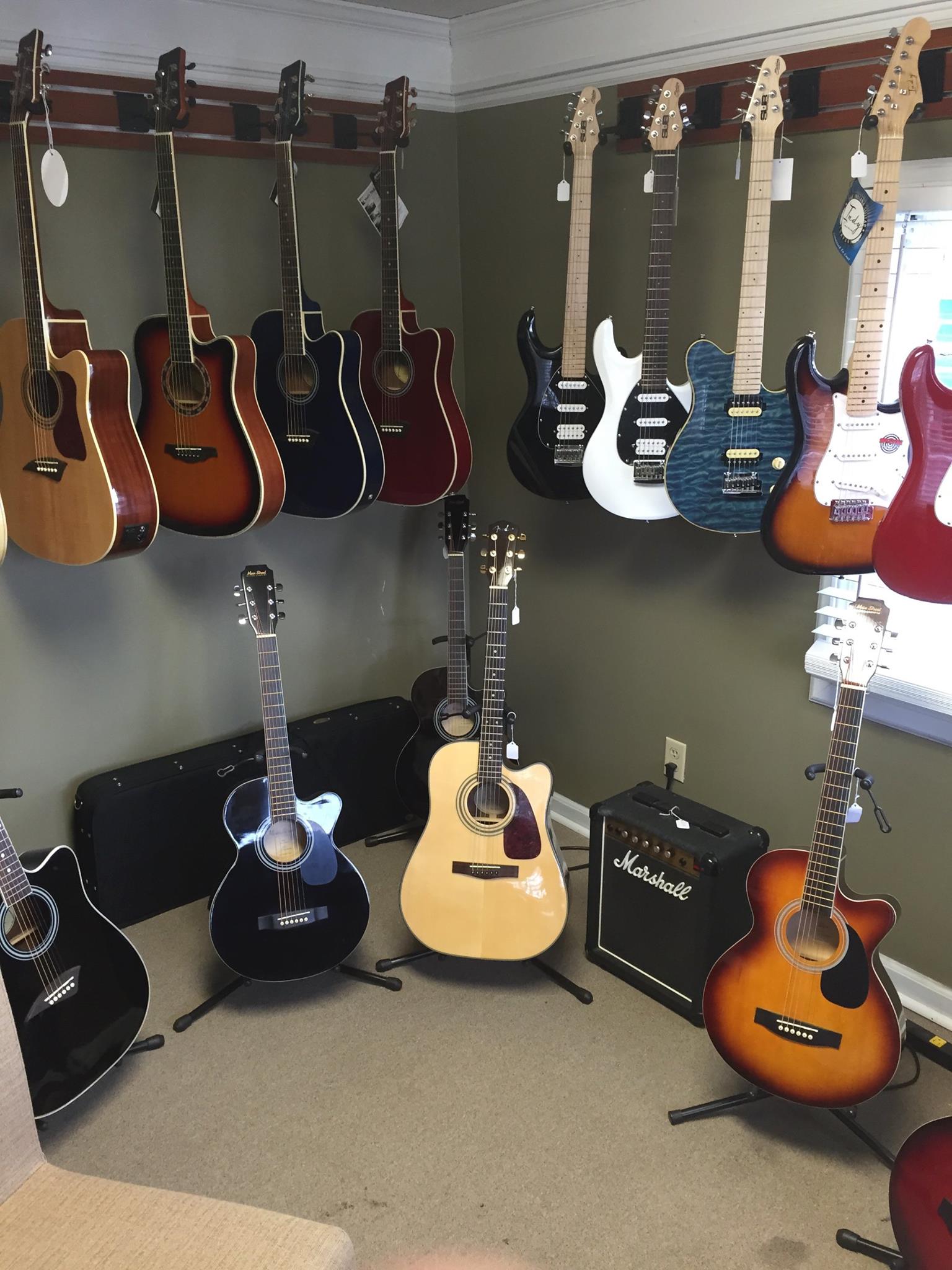Acoustic and electric guitars in stock