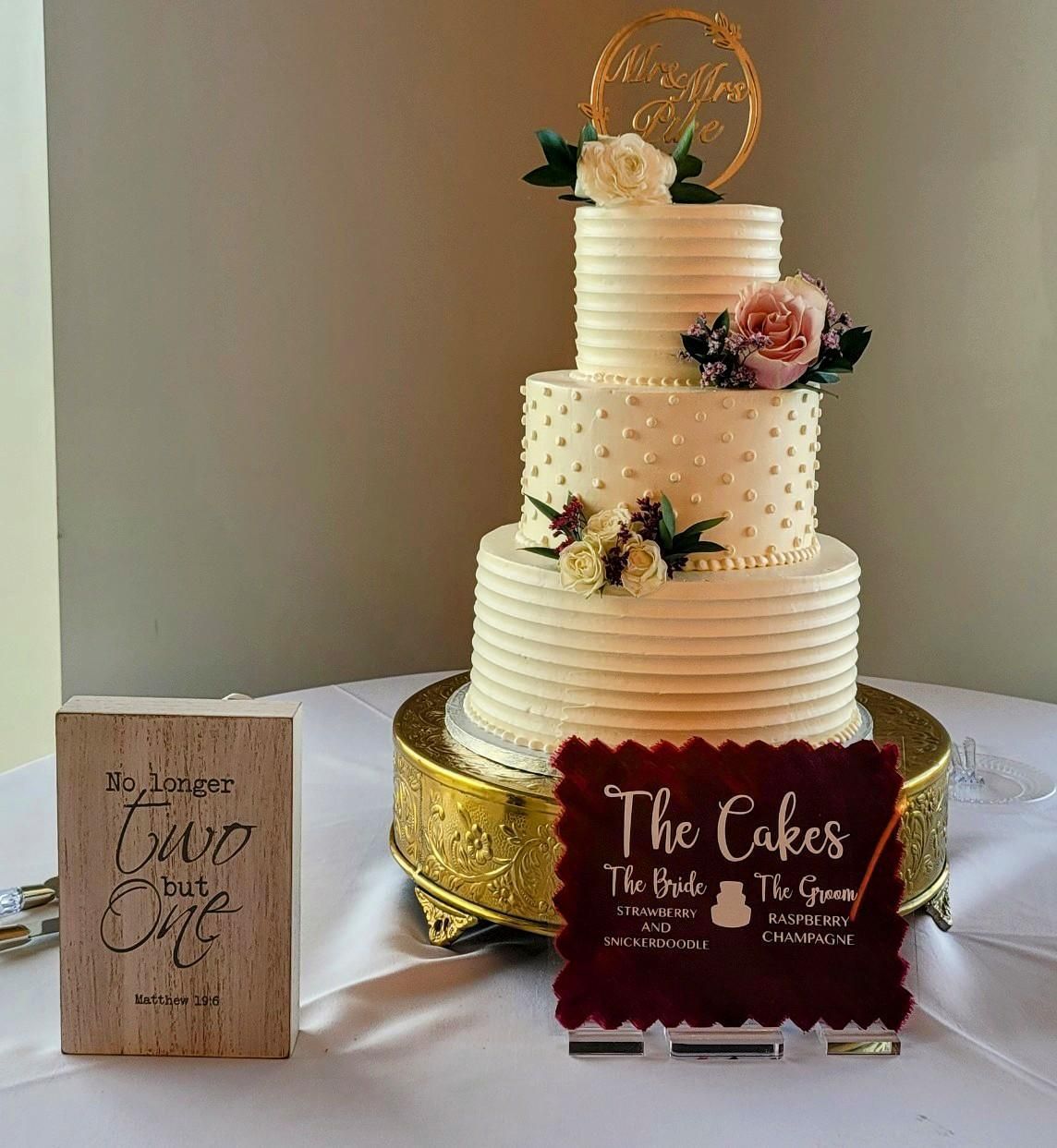 A wedding cake is on the table.