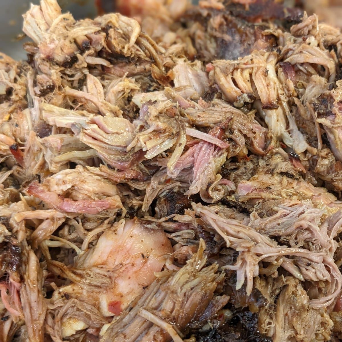 A close up of a pile of shredded pork.