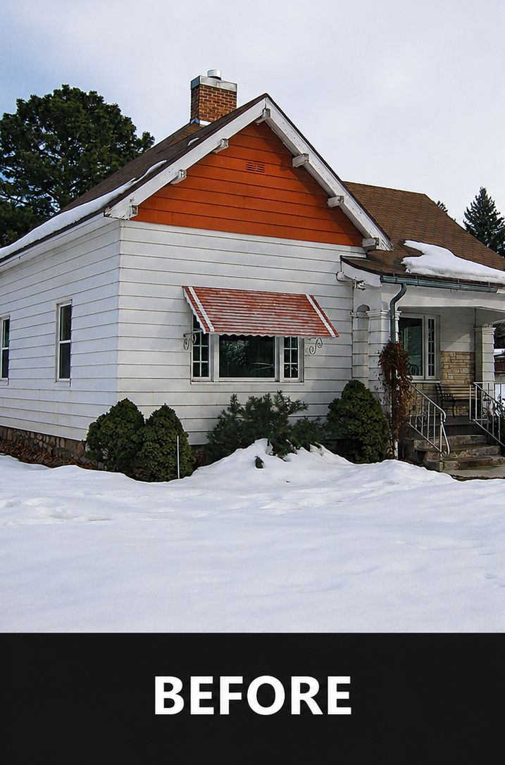 Snowy white house with orange front gable and awning