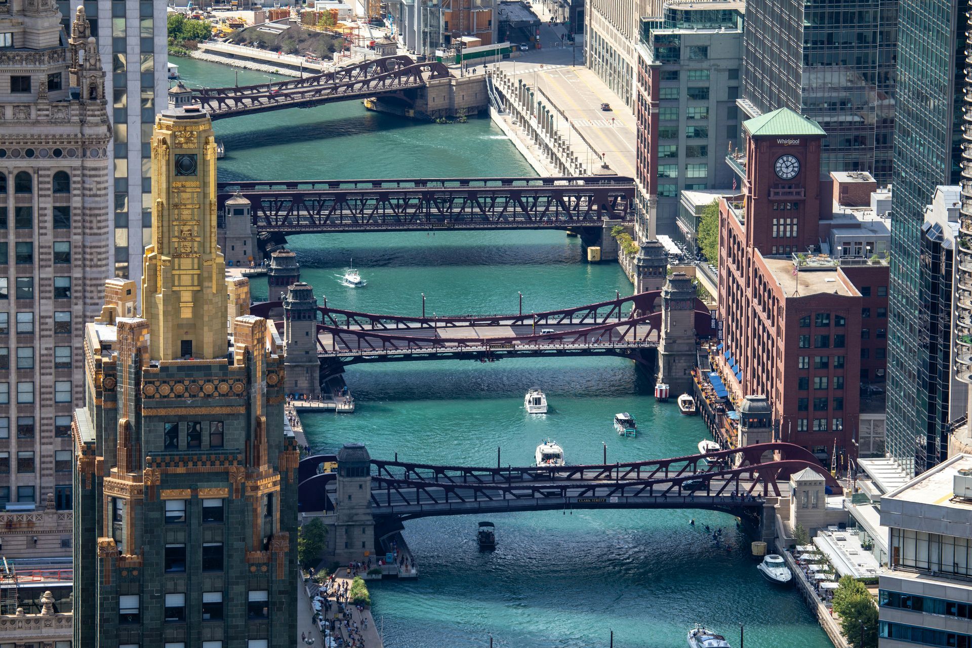 Chicago River with bridges and buildings, turquoise water.