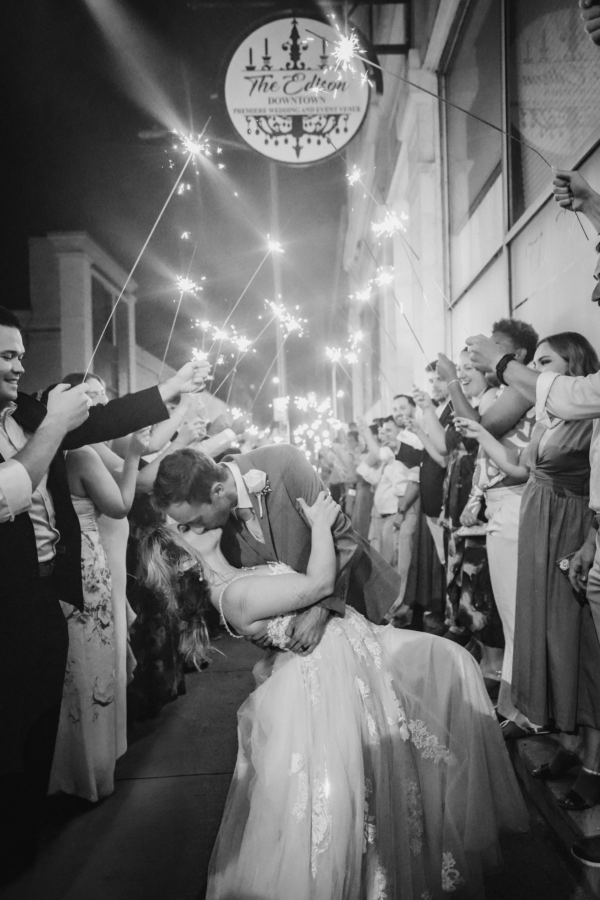 Black and white photo of a crowded wedding hall