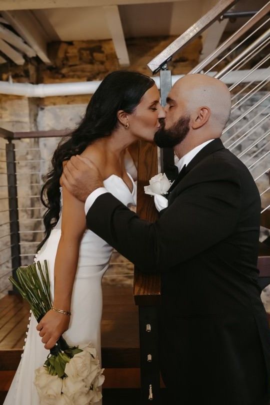 Bride and groom kissing