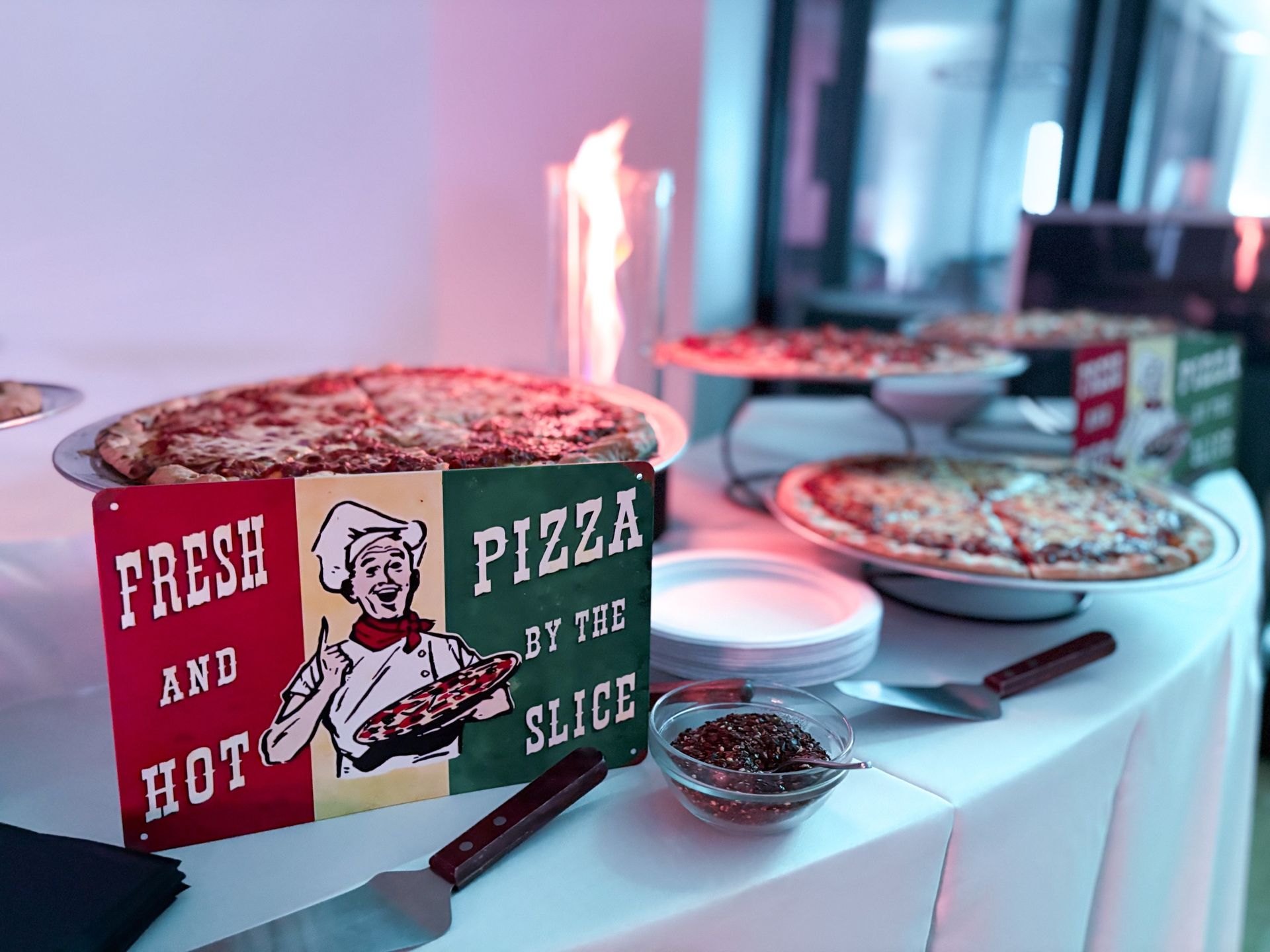A table set up for a pizza event