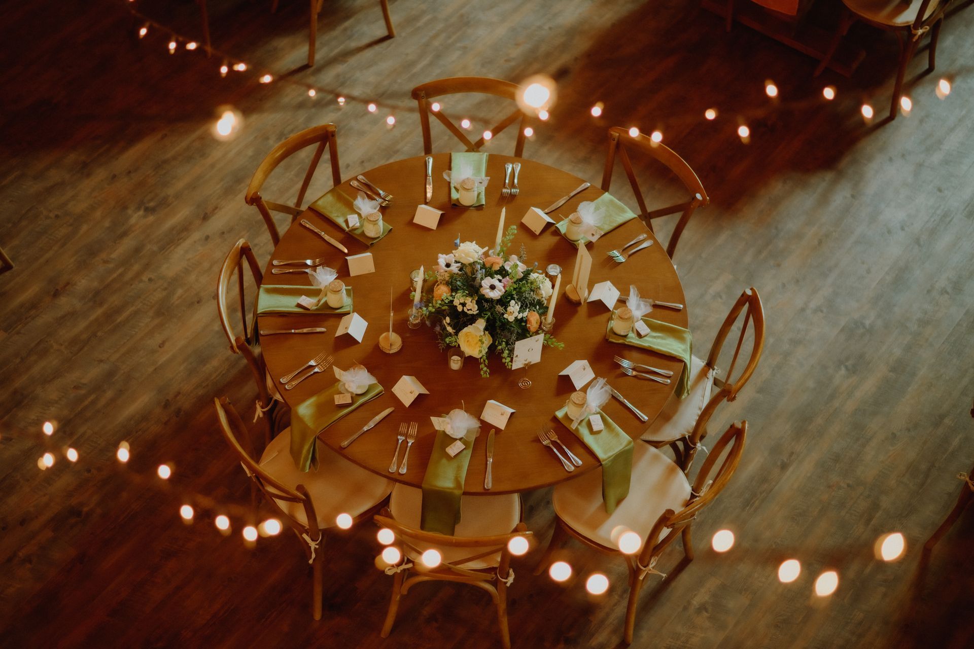 A wooden table set up for an event