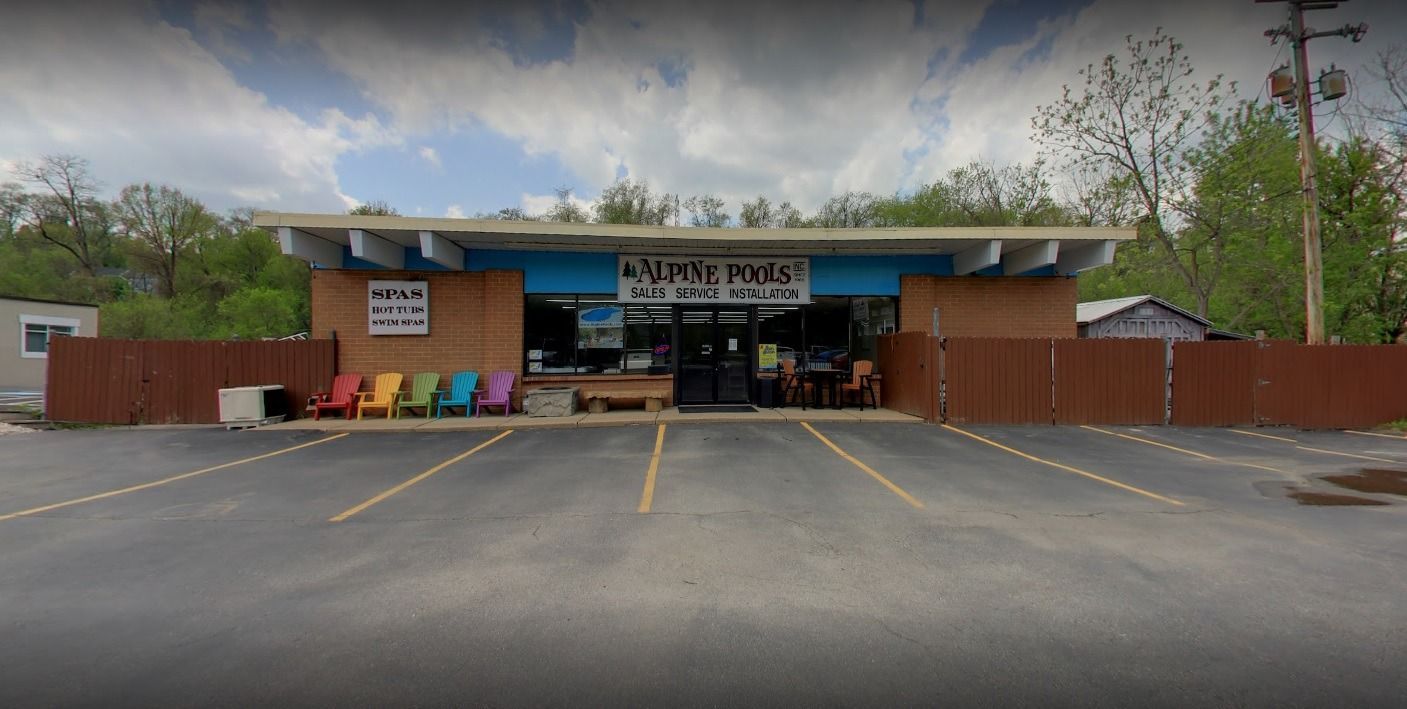 A store front with a lot of chairs in front of it.