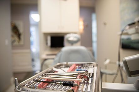 A tray of dental instruments in a dental office.