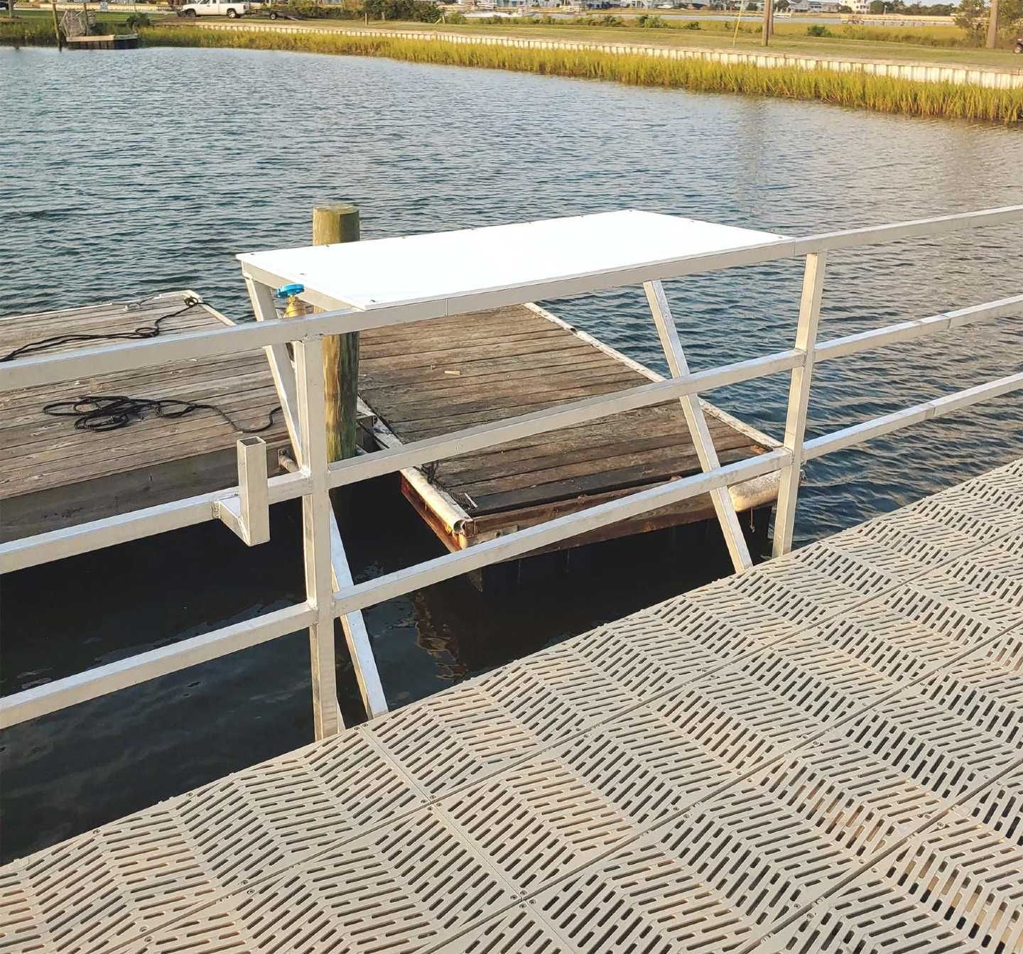 A dock with a white table on top of it